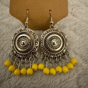 Silver with yellow stone